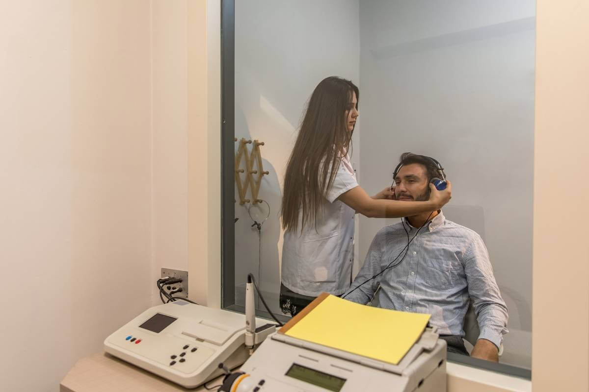 man preparing for getting a hearing test at the doctor's office